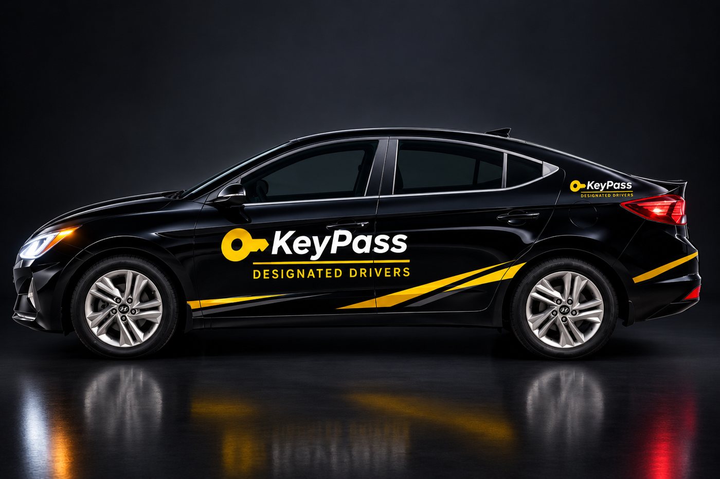 Side view of the black KeyPass car with gold stripes and logo